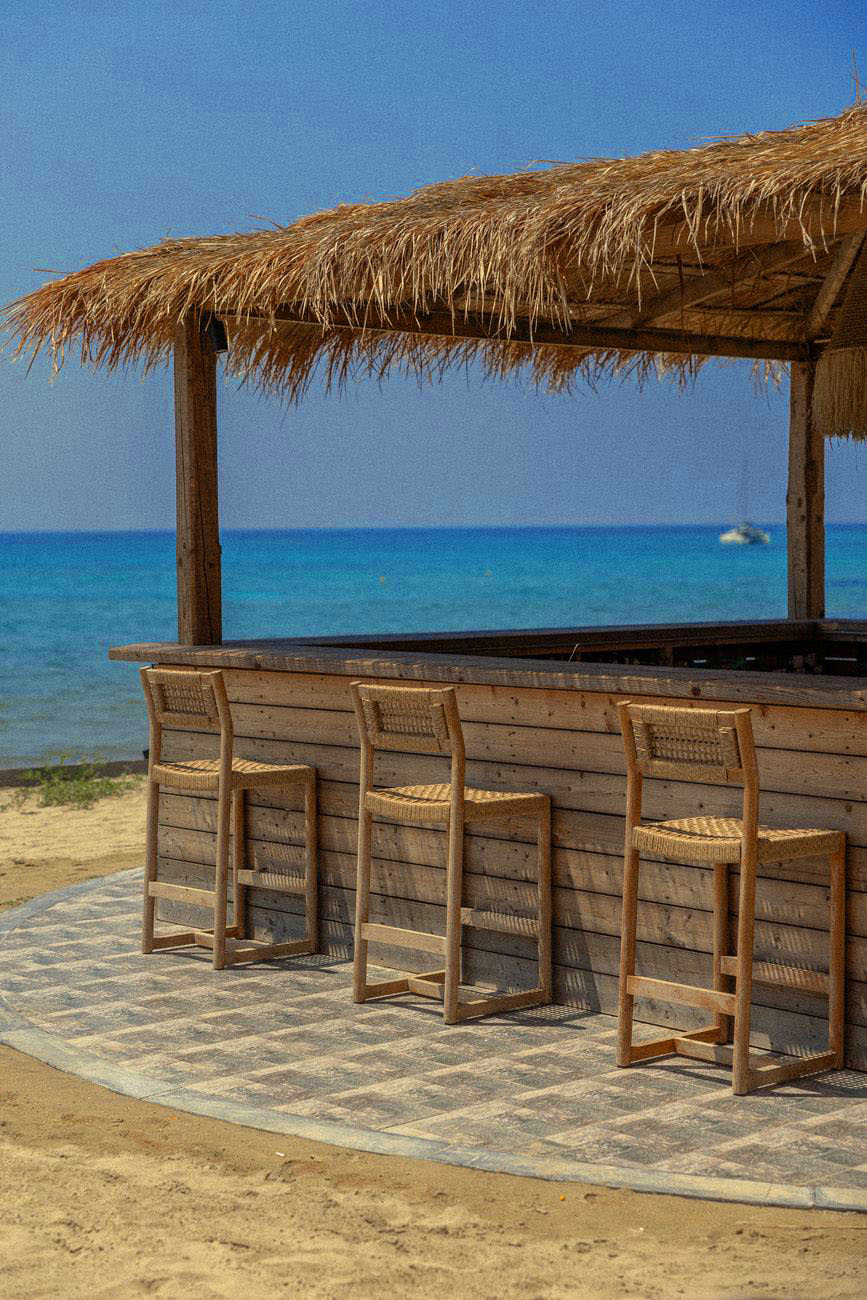 The thatched sand bar with woven stools