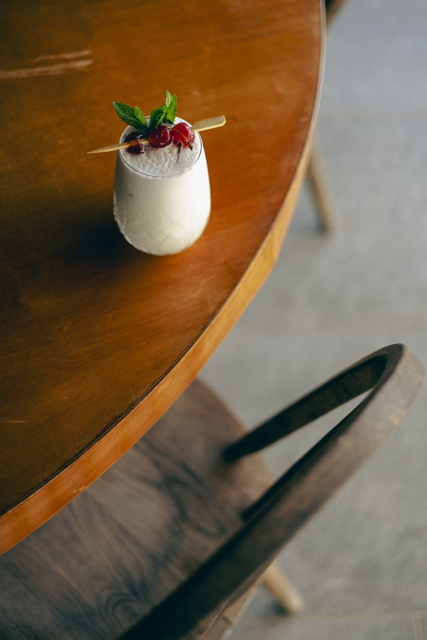 Signature cocktail on a wooden table